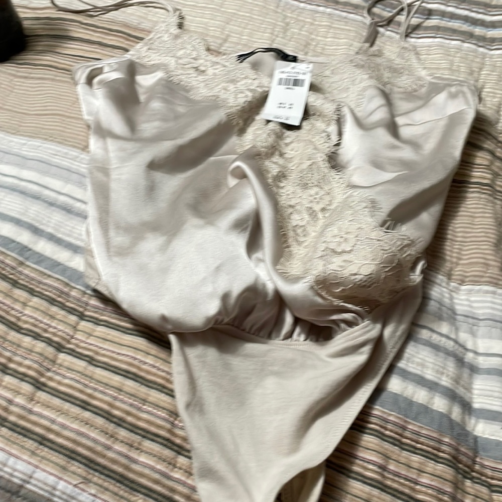 Abercrombie &Fitch womens body suit New with tags never worn size Small. Cream